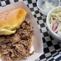 Chopped Brisket Sammich Meal · Chopped brisket served on a toasted bun with choice of signature BBQ sauce. Served with 2 si...
