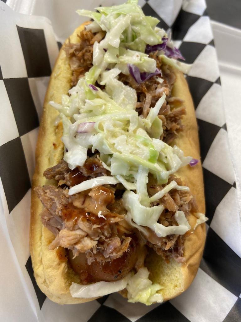 Swabby Dawg Family Meal · 4 smoked brats topped with chopped pork and slaw with choice of 2 large sides.
