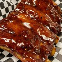 1/2 Rack Pork Spare Ribs Meal · 5 to 6 bones generously seasoned and glazed in our signature house BBQ sauce. Served with 2 ...