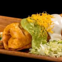 Chimichanga Tostada · Sour cream, guacamole, cheese, lettuce and pico de gallo.