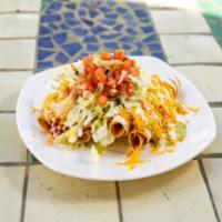 8. Four Rolled Tacos with Guacamole Combination Platter · 
