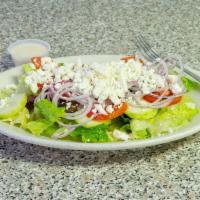 Greek Salad · Fresh romaine lettuce, plum tomatoes, cucumber, red onions, feta and olives.