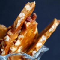 Bacon Peanut Brittle · 4.5oz bag of bacon peanut brittle, our favorite salty sweet meat treat.