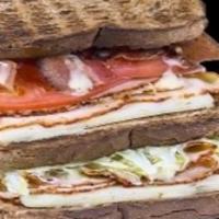 Cluck'en Club Sandwich · Buffalo chicken breast (sliced), pepper jack cheese, bacon, lettuce, tomato, honey dijon dre...
