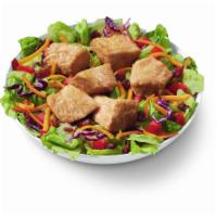 Rotisserie BLT Salad Bowl · 100% white meat, juicy, tender, rotisserie-style chicken bites, served on top of a crisp bed...