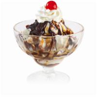 Turtle Candy Sundae · Vanilla ice cream with hot fudge, caramel, pecans, whipped cream and a cherry.