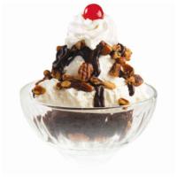 Fudge Brownie Sundae · A warm brownie with vanilla ice cream, hot fudge, pecans, whipped cream and a cherry.