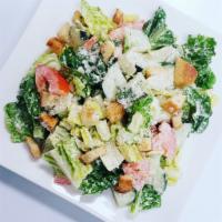 Caesar Salad · Lettuce, cucumbers, tomato, croutons, Parmesan cheese and Caesar dressing.