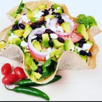 Taco Salad · Lettuce, tomato, black beans, red onions, avocado, feta cheese and lime dressing.