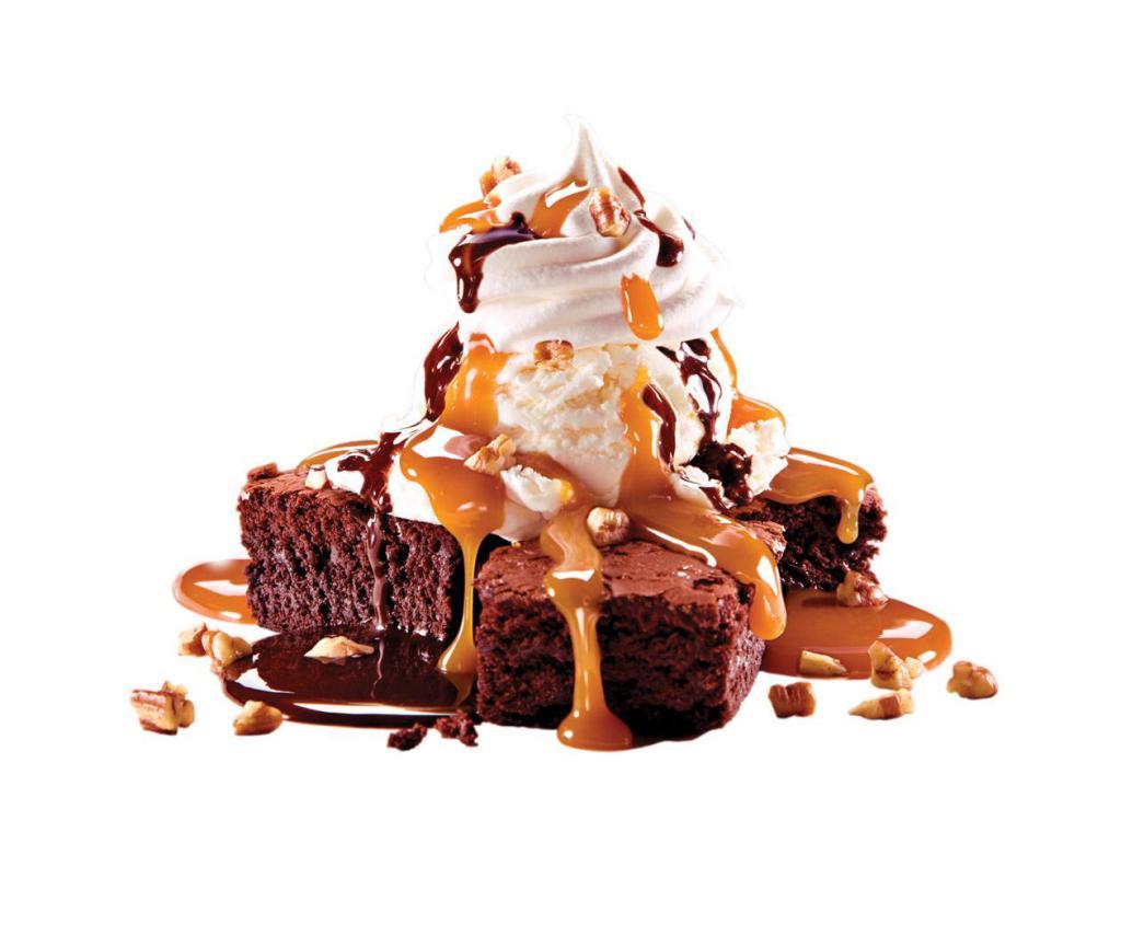 Brownie a la Cold Stone · Warm Chocolate Brownies With French Vanilla Ice Cream And Whipped Topping, Caramel, Fudge, Pecans.