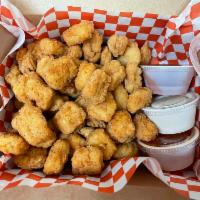 Popcorn Chicken · Popcorn chicken served with cumin BBQ, ranch, and Louisiana hot sauce dips.