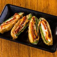 Jalapeno Popper (4 pcs) · tempura batter deep fried jalapeño stuffed with spicy tuna and cream cheese and top with spi...