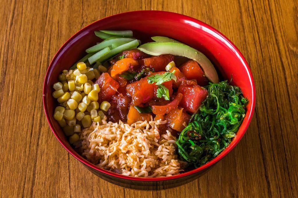 Poke Bowl · Tuna, salmon mixed with poke sauce, crab mix, avocado, seaweed salad, and sweet corn. Served on top of rice.