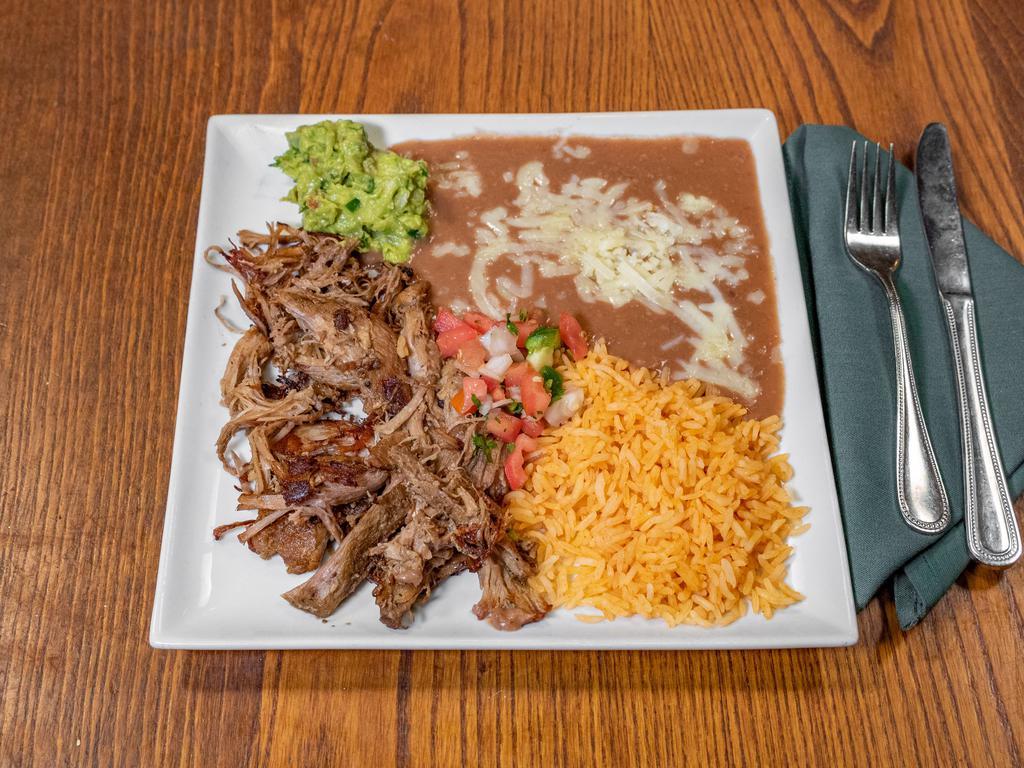 Carnitas Plate · Slow cooked pork, marinated with citrus flavors. Served with cilantro, guacamole and pico de gallo. Choice of corn or flour tortillas.