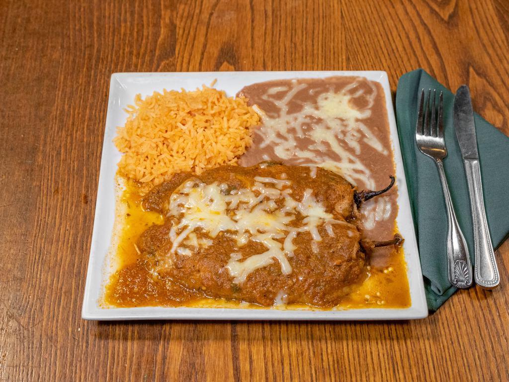 1 Chile Relleno · Fried roasted chilaca pepper stuffed with cheese. Topped with ranchera sauce. Choice of corn or flour tortillas. Vegetarian. 