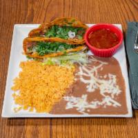 Quesabirria Tacos · 2 tacos stuffed with birria, onion, cilantro and cheese. Served with delicious side of con s...