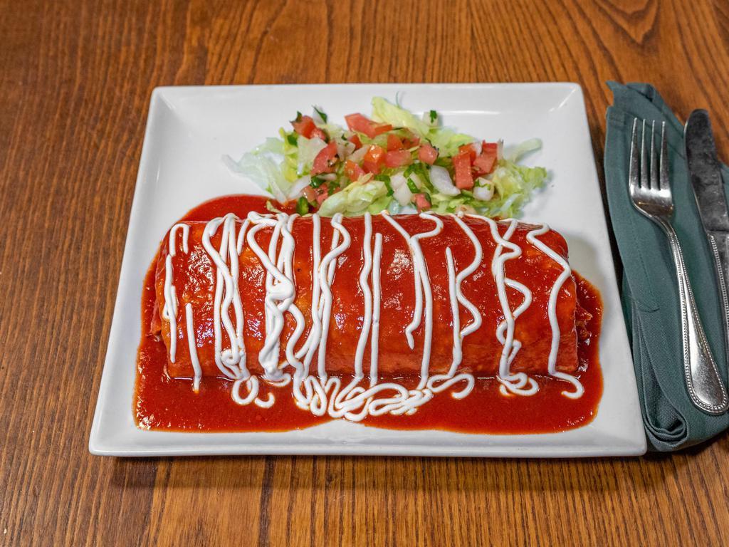 Super Wet Burrito · Choice of pastor or carnitas served with pico de gallo, guacamole, sour cream, rice and beans inside burrito. Choice of red or green sauce.
