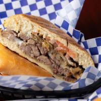 The Tri Tip Sandwich · Hero Dunkel. Ciabatta, smoked tri-tip, caramelized onions, tomatoes, provolone and horseradi...