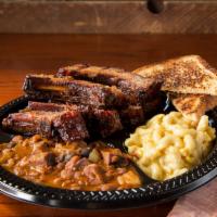 Baby Back Ribs · Served with choice of 2 sides.