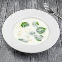 Zuppa Di Pollo Con Gnocchi Di Patate · Creamy chicken soup with dumpling gnocchi and spinach.