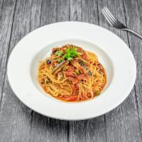Cappellini Alla Puttanesca · Cappellini with puttanesca sauce (A combination of anchovies, capers, kalamata olives, onion...