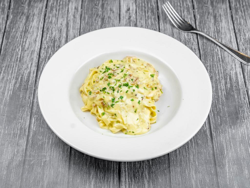 Fettuccine Carbonara · Fettuccine pasta with smoked pancetta and a creamy egg cheese sauce.