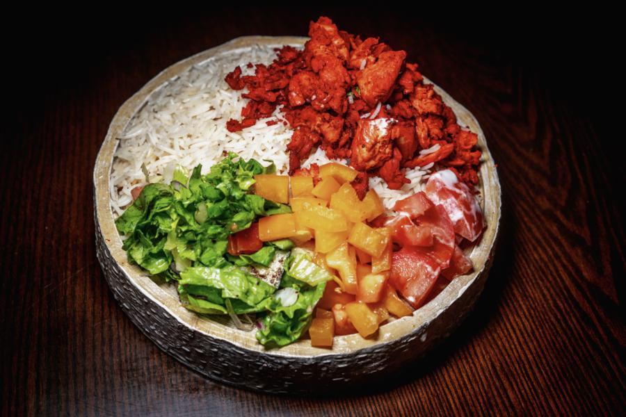 Chicken Over Rice Bowl  · Served with chicken, rice, lettuce, and tomatoes along with your favorite toppings and white and hot sauce.
All our products are halal.