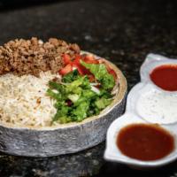 Lamb Gyro Over Rice Bowl  · Served with gyro, rice, lettuce, and tomatoes along with your favorite toppings and white an...