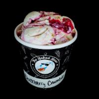 Blackberry Crumble Pint · Vanilla bean ice cream with a blackberry ripple and pie crust pieces.