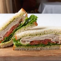 Mason Sandwich · Roast turkey on sliced sourdough, pesto, mayo, lettuce tomato and Swiss cheese.