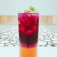 Purple Paradise 16oz · lemon juice, kumquat juice, grape juice, and butterfly pea flower tea