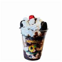 Cookie Monster · Home made cookies and cream ice cream topped with Oreo pieces and chocolate syrup.