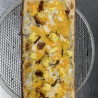 Breakfast Scrambler Pizza · Flatbread crust with egg, sausage gravy, bacon and cheddar cheese.