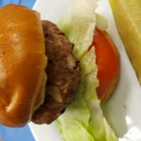 Grilled Turkey Burger · Ground turkey on a toasted bun, red cheddar or Swiss cheese, onions, lettuce, tomatoes and g...