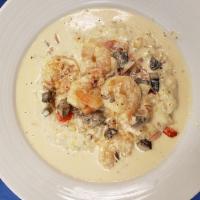 Southern Shrimp and Grits · Southern Shrimp and Grits 6 grilled shrimps with creamy garlic sauce, mushrooms, tomatoes,on...