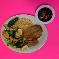Filete A La Plancha Plate/grilled fish · Boneless grilled fish with vegetables , rice, and beans.