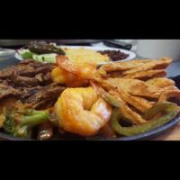 Fajitas Mixta · Shrimp, chicken and steak. Served with salad, vegetables, rice, beans, french fries. Choice ...