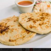 Pork and cheese pupusa. · homemade tortilla filled out  pork and cheese