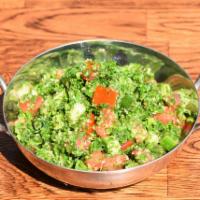 Tabouli Salad · Chopped Persian cucumber, tomato, parsley and bulgar with lemon dressing. Vegetarian.