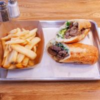 Lamb Gyro Sandwich · Combination of beef and lamb, lettuce, tomato and pickles.