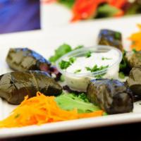 Dolmeh · 6 pieces grape leaves stuffed with rice, fresh herbs and seasoning. Served with pita bread. ...