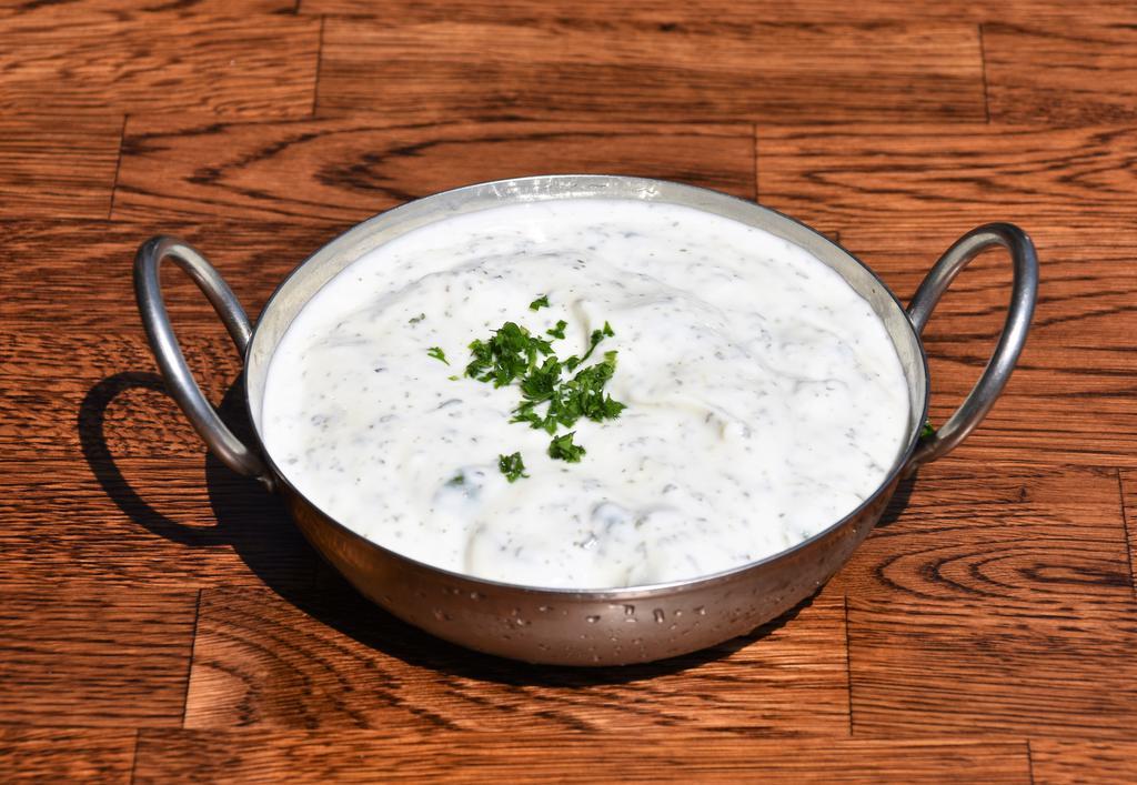 Yogurt Dip · Yogurt blended with topped cucumber. Served with pita bread. Gluten free and vegetarian.