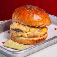 Garlic Butter Burger · Double Angus patty, American cheese, miso butter onions and slow poached garlic on a miso ga...