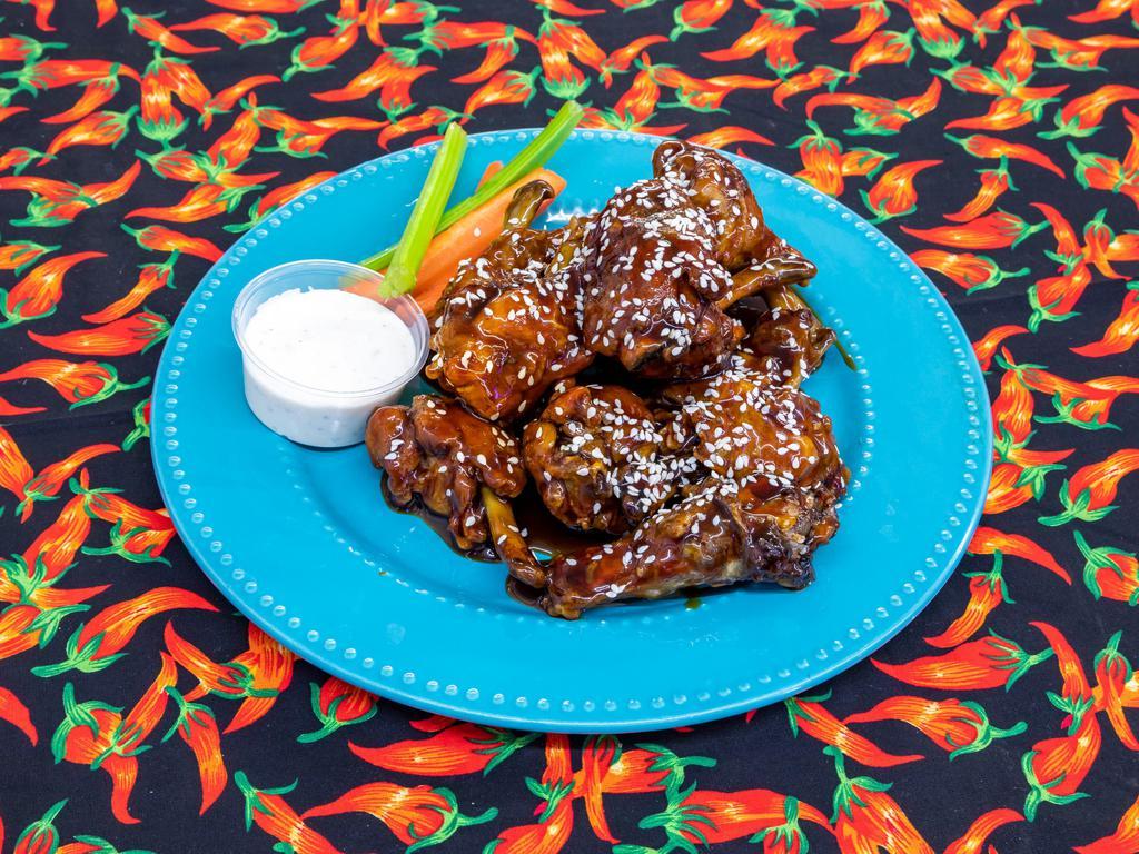 Chicken Wings · 1 dozen naked and fried wings tossed in sauce of your choice. Served with celery. Add extra ranch for an additional charge.