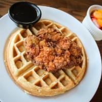 Chicken & Waffles · Hand-breaded boneless chicken breast, fried golden, and served over a Belgian waffle with re...