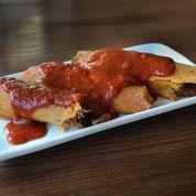 Pork Tamales · Traditional Delta tamales served with roasted ancho chili sauce, or try them battered and de...