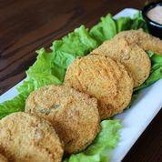 Fried Green Tomatoes · Sliced green tomatoes dusted with cornmeal and pan fried. Served with comeback sauce.