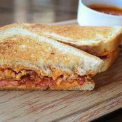 Mama Rue · House pimento and cheese, bacon, tomato on grilled sourdough.
