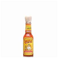 Side of Hot Sauce · A small bottle of Cholula Hot Sauce.