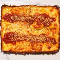 1946 Cheese Pizza · Classic Detroit style red racing stripe sauce and oregano. Made with our Wisconsin brick che...
